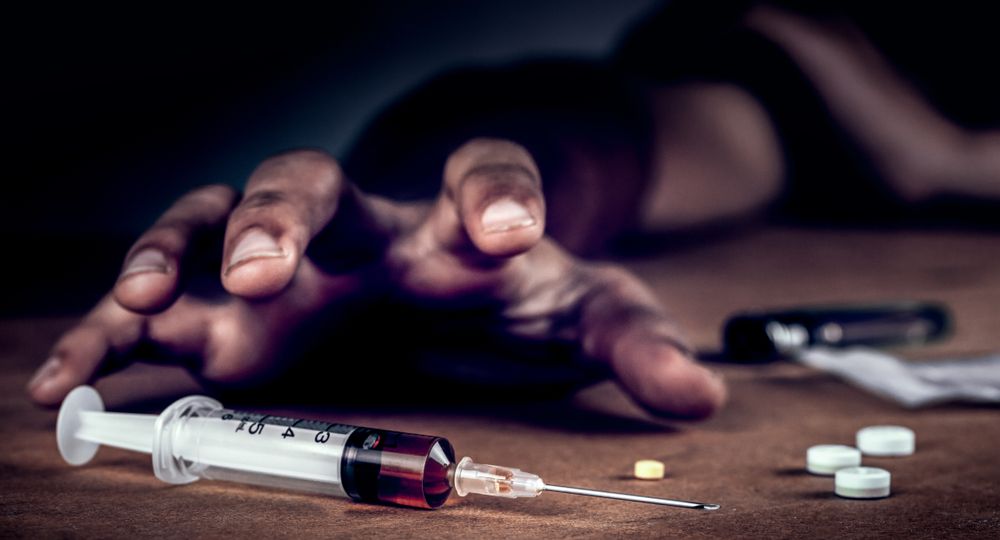 Addict,Man,Grab,Drug,Syringe,Of,Heroin.social,Disaster,And,Epidemic